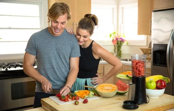 couple in kitchen with blender