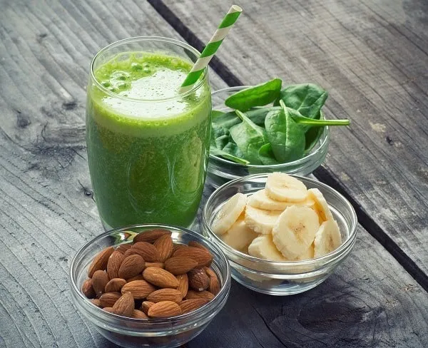 Green fresh healthy smoothie with fruits and vegetables spinach and banana smoothies